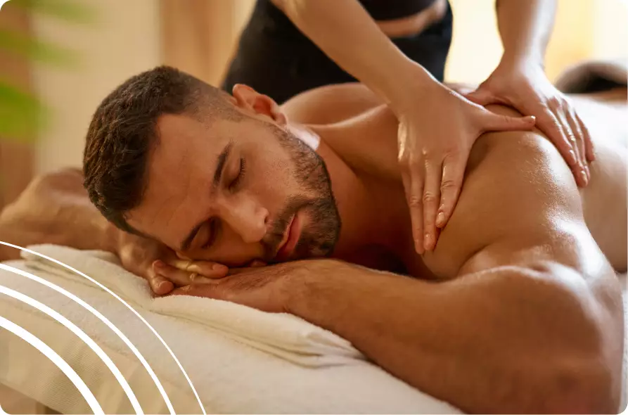 A man receiving a relaxing swedish body massage at our health spa in Las Vegas, featuring deep tissue techniques to relieve shoulder tension.